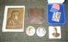 Group of bas-relief plaques and bookends depicting Theodore Roosevelt and his home.